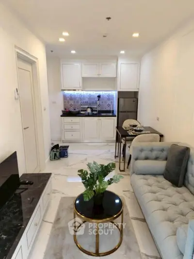 Modern living room with stylish kitchen and cozy seating area