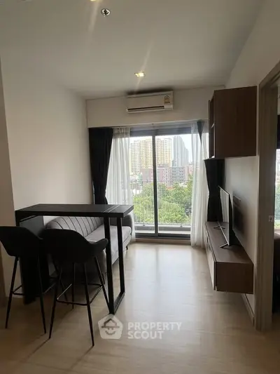 Modern living room with balcony view in high-rise apartment