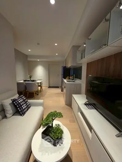 Modern living room with sleek furniture and open layout, perfect for urban living.