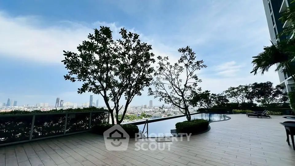 Luxurious rooftop pool with stunning city skyline view, perfect for relaxation and leisure.