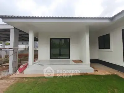 Modern single-story house with a minimalist design and spacious front porch.