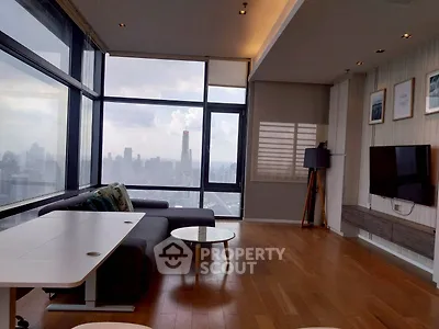 Stunning modern living room with panoramic city views and sleek furnishings.