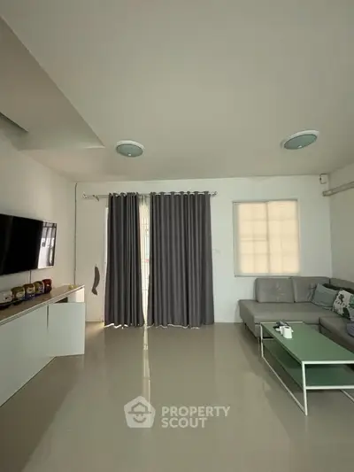 Modern living room with sleek furniture and natural light