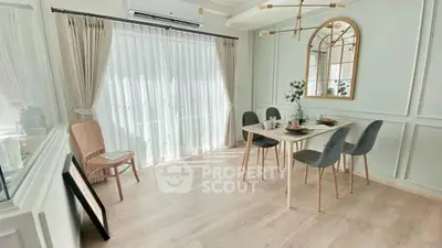 Elegant dining room with natural light and modern decor