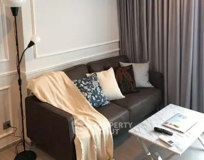 Cozy living room with stylish sofa and elegant decor