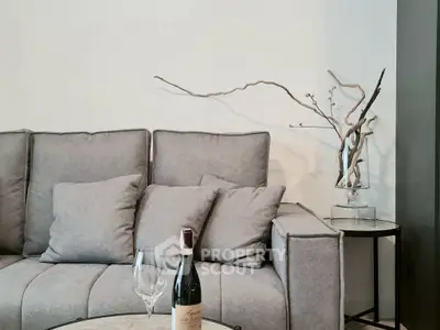 Elegant living room with modern gray sofa and stylish decor