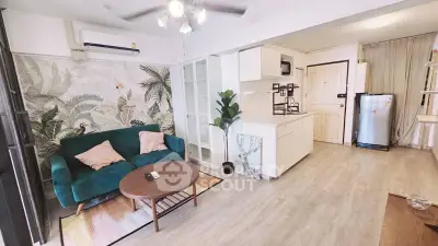 Charming open-layout living room with modern kitchen, cozy seating, and stylish decor in a bright apartment.