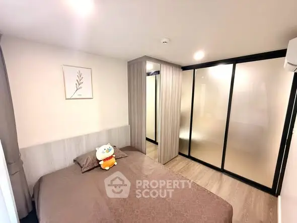 Modern bedroom with sleek design and ample closet space
