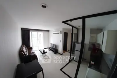 Modern living room with sleek design and balcony access in urban apartment