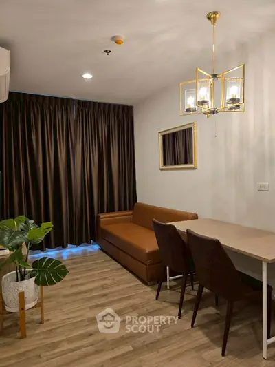 Modern living room with elegant lighting and cozy seating area