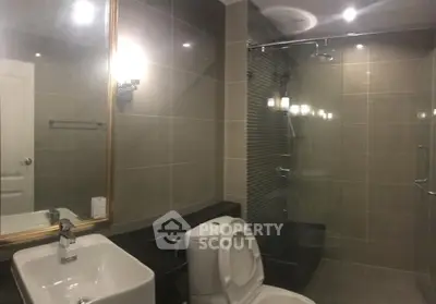 Modern bathroom with glass shower and elegant fixtures