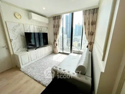 Luxurious living room with modern decor and stunning city view from large windows.