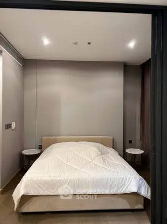 Modern bedroom with cozy bed and ambient lighting