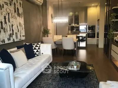 Luxurious open-plan living room with elegant decor and modern kitchen