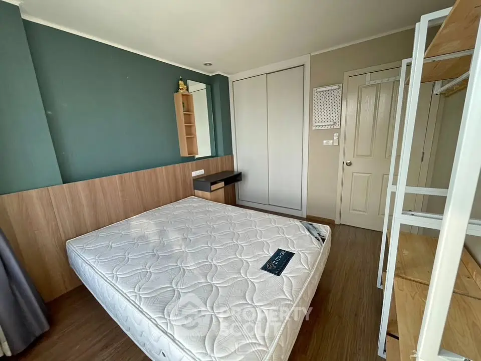 Modern bedroom with stylish decor and ample storage space