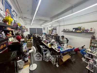 Creative workspace with art supplies and figurines in a spacious studio setting.
