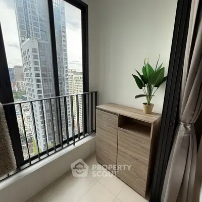 Modern high-rise apartment with stunning city view and stylish interior decor.