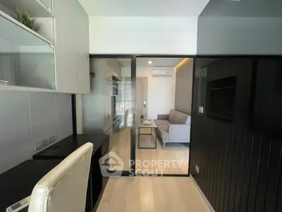 Modern apartment interior with glass partition and stylish furnishings