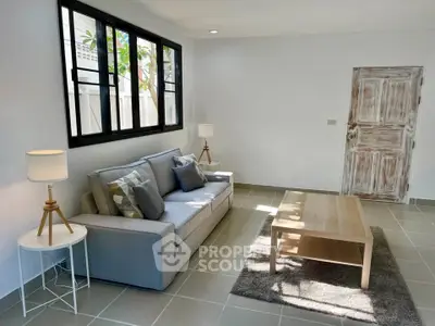 Bright and cozy living room with modern furniture and natural light