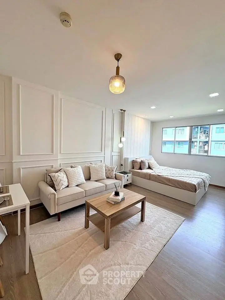 Modern studio apartment with cozy living area and stylish decor