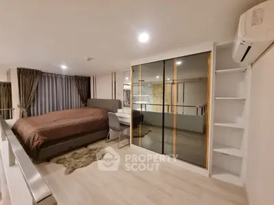 Modern bedroom with mirrored wardrobe and cozy lighting