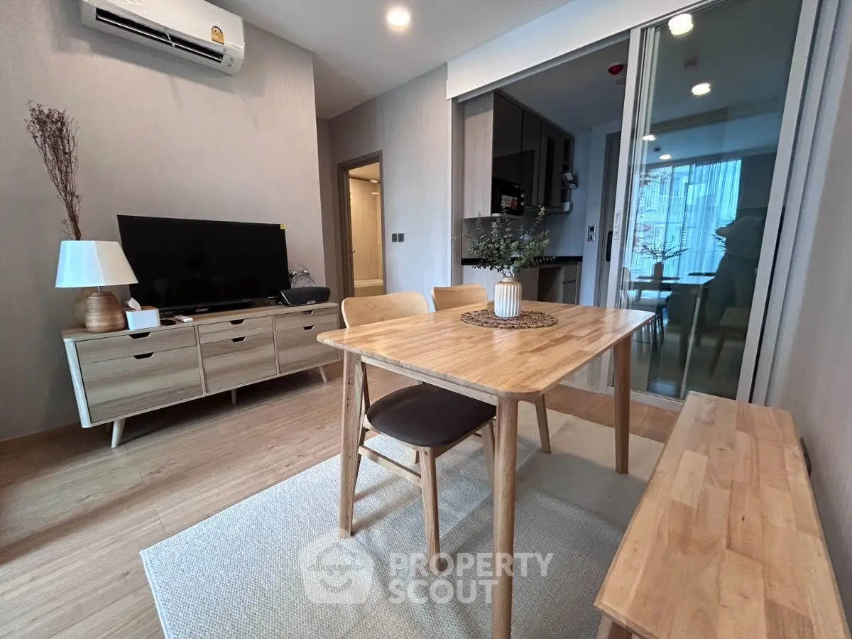 Modern living room with wooden furniture and stylish decor in a cozy apartment.