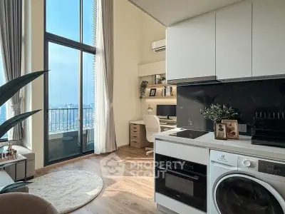 Modern living room with high ceilings, large windows, and integrated kitchen appliances.