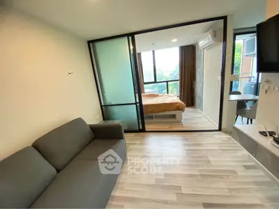 Modern apartment with sliding glass doors and cozy bedroom