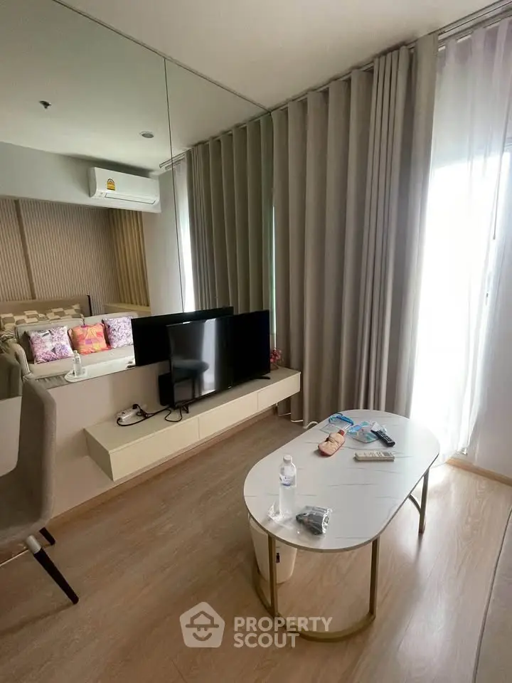 Modern living room with sleek TV setup and cozy decor