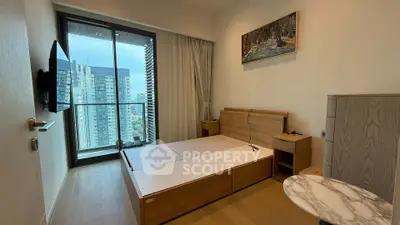 Modern bedroom with balcony view in high-rise apartment