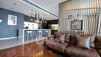 Luxurious open-plan living room with modern kitchen and stylish decor