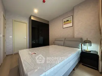 Modern bedroom with stylish decor and ample natural light