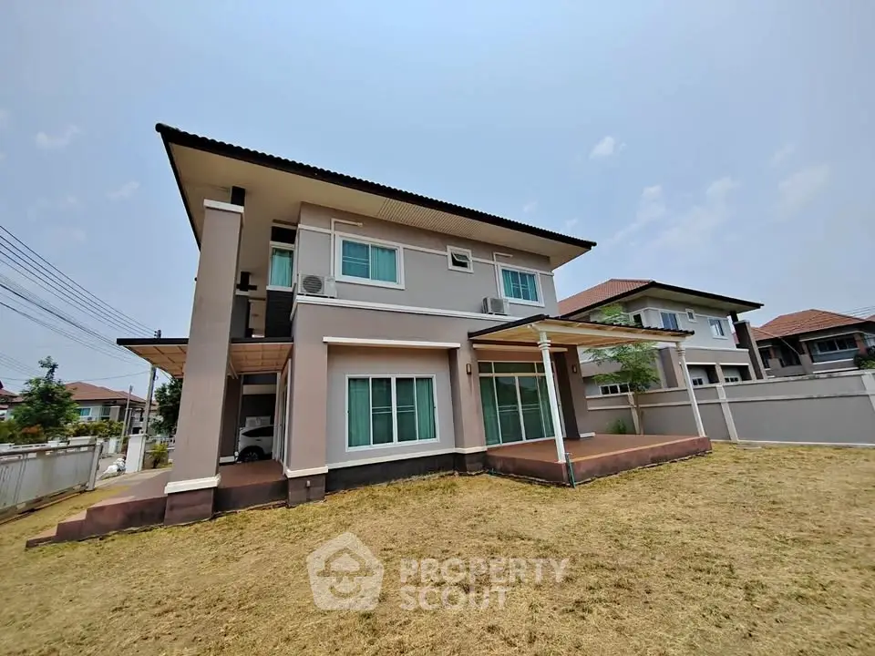 Spacious two-story house with large yard and modern design
