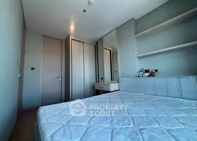 Modern bedroom with sleek design and ample storage space