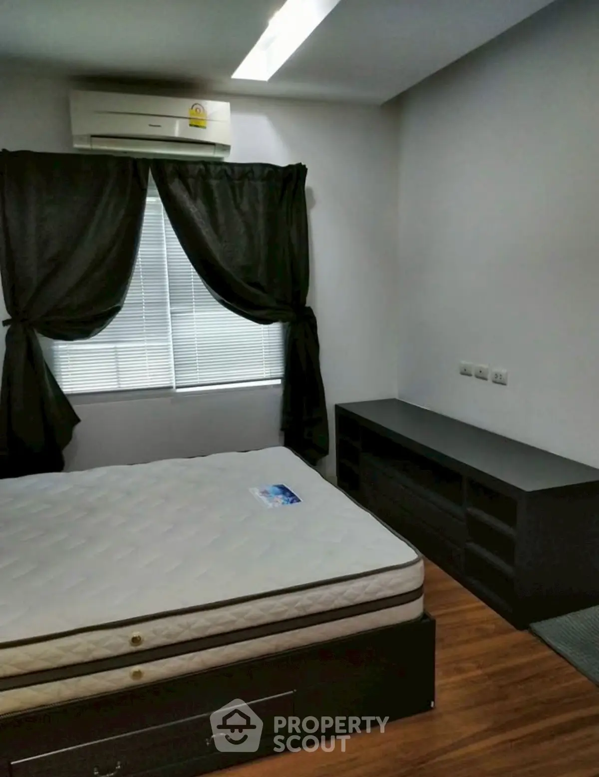 Cozy bedroom with modern furnishings and natural light