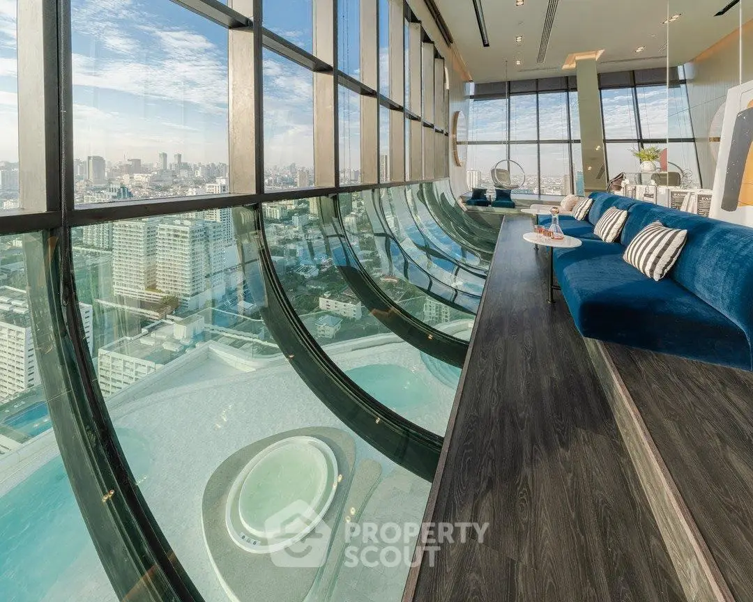 Luxurious high-rise living room with panoramic city views and modern design.