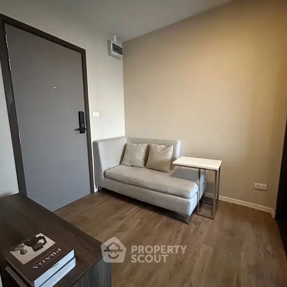 Cozy small living room with modern sofa and wooden flooring