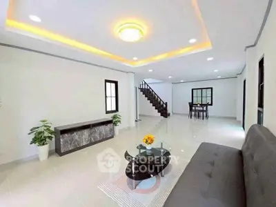 Spacious modern living room with elegant lighting and stylish furniture