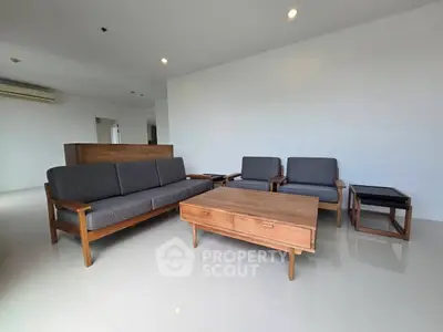 Spacious living room with modern wooden furniture and sleek design
