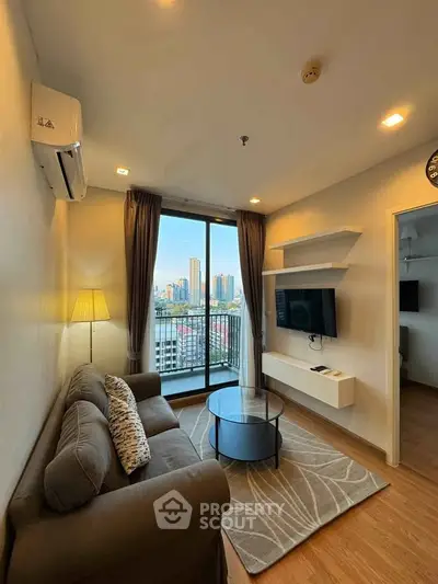 Modern living room with city view, featuring cozy sofa, wall-mounted TV, and elegant decor.