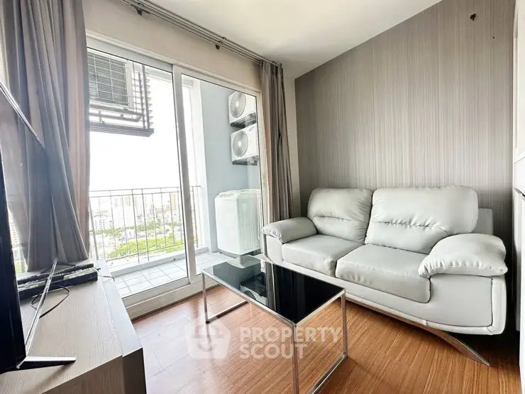 Modern living room with balcony view and sleek furniture in urban apartment