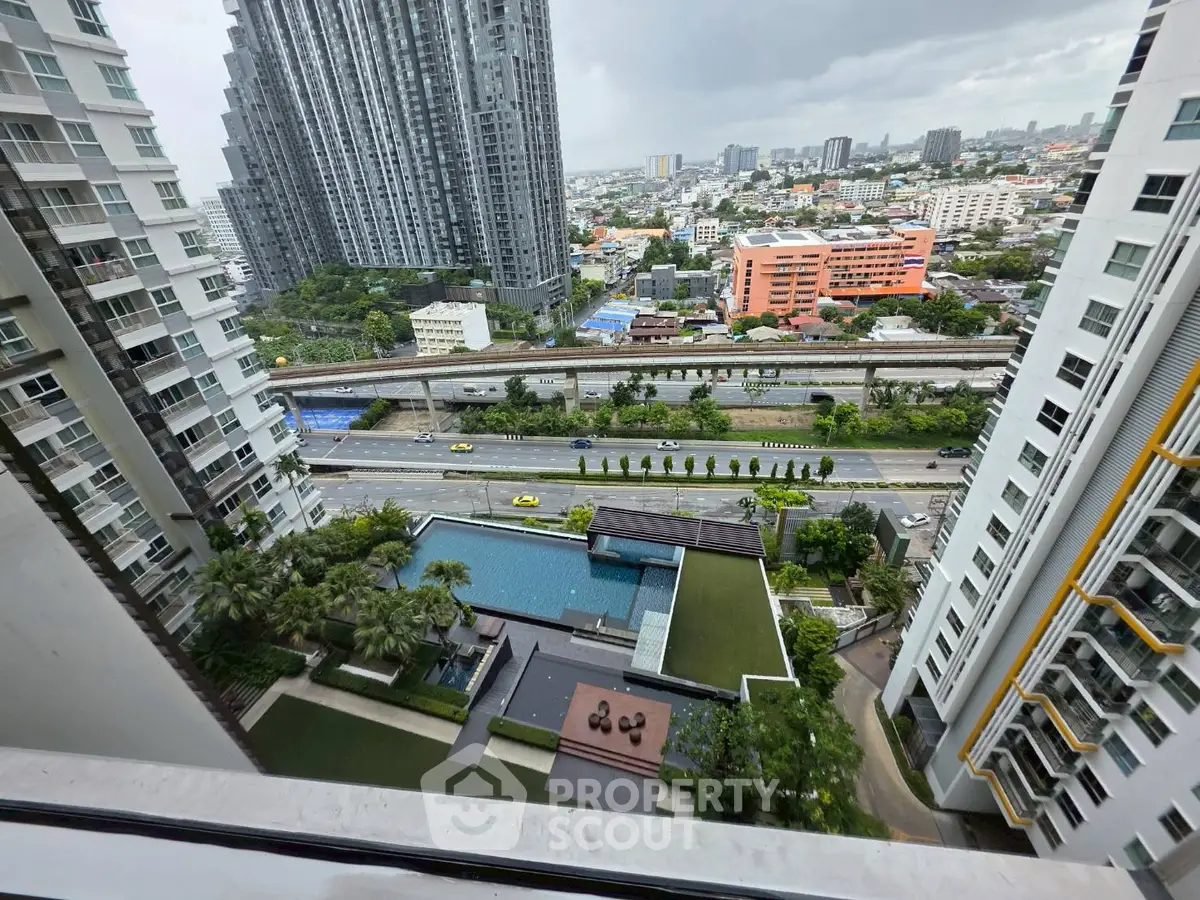 Stunning high-rise view with pool and cityscape, perfect for urban living enthusiasts.