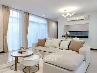 Spacious modern living room with elegant decor and large windows