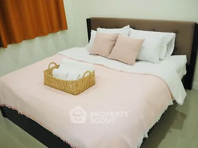 Cozy bedroom with stylish bed and soft pink accents