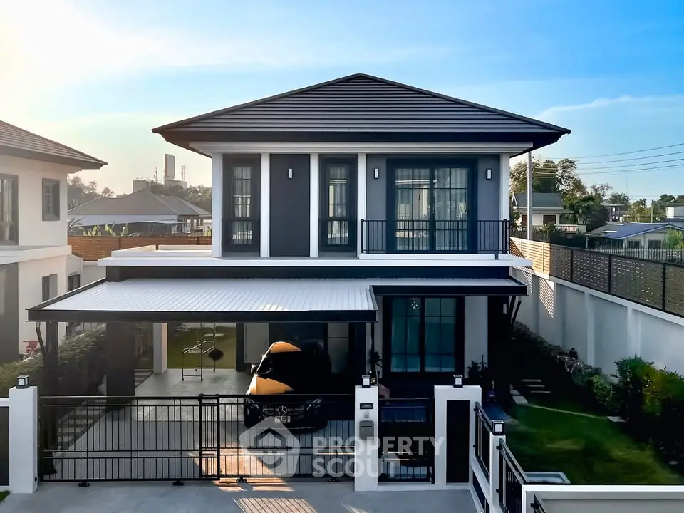 Modern two-story house with sleek design and spacious driveway