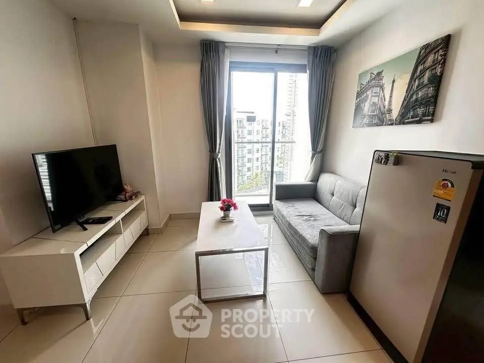 Modern living room with sleek furniture and city view, perfect for urban living.