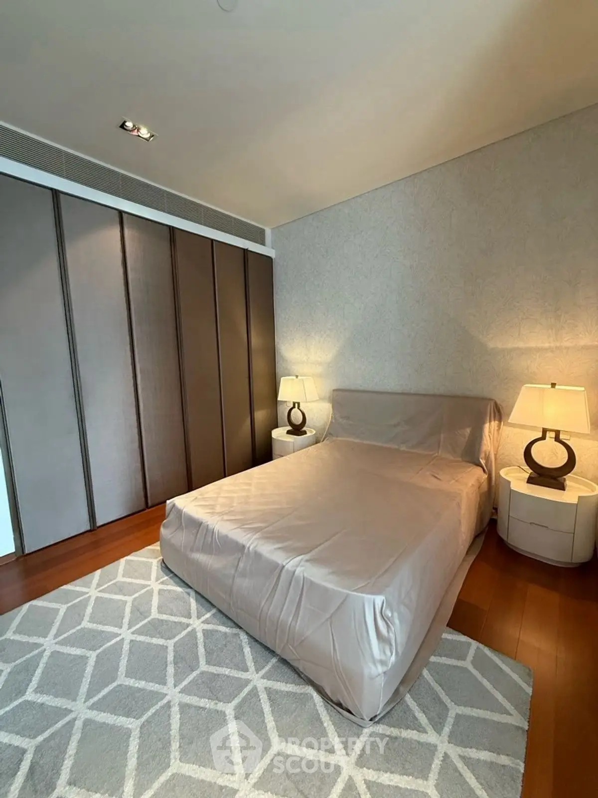Elegant bedroom with modern decor and cozy lighting