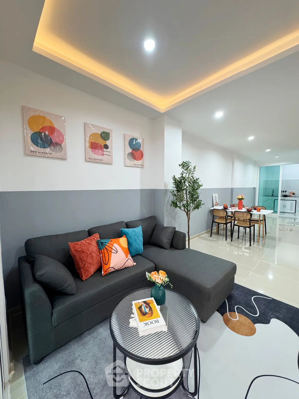 Modern living room with stylish decor and open dining area