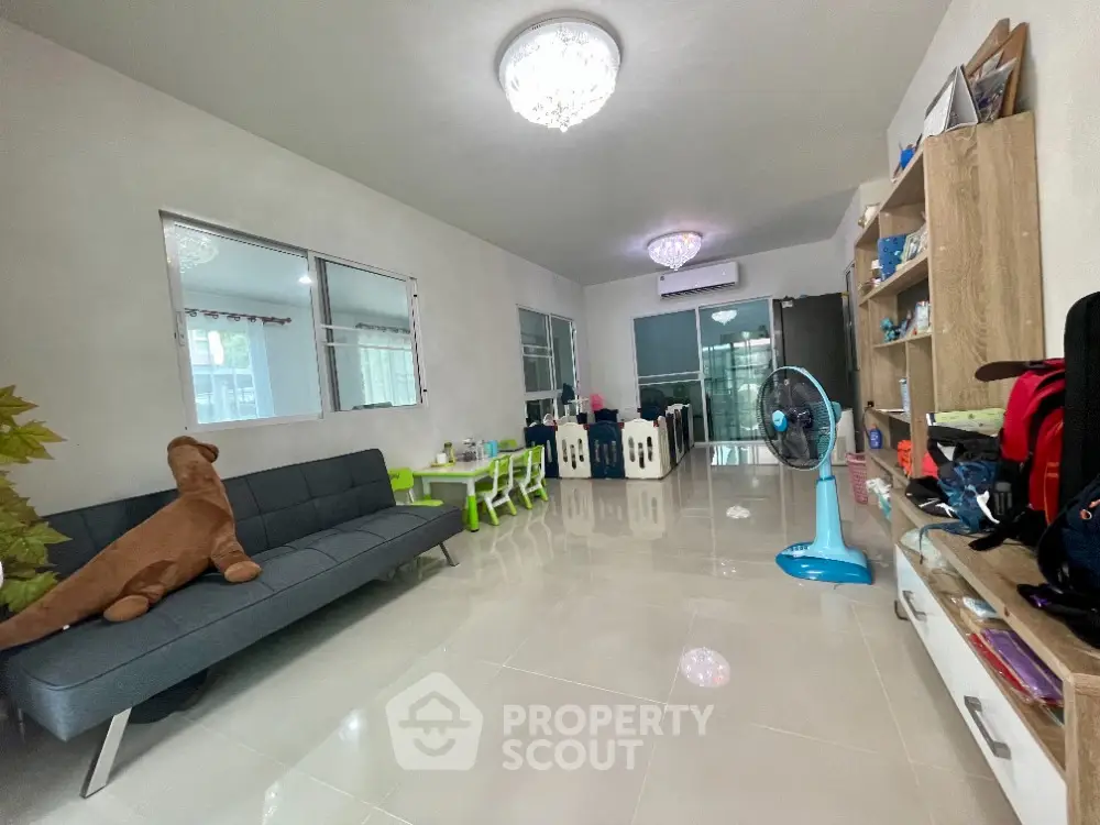 Spacious living room with modern decor and ample natural light