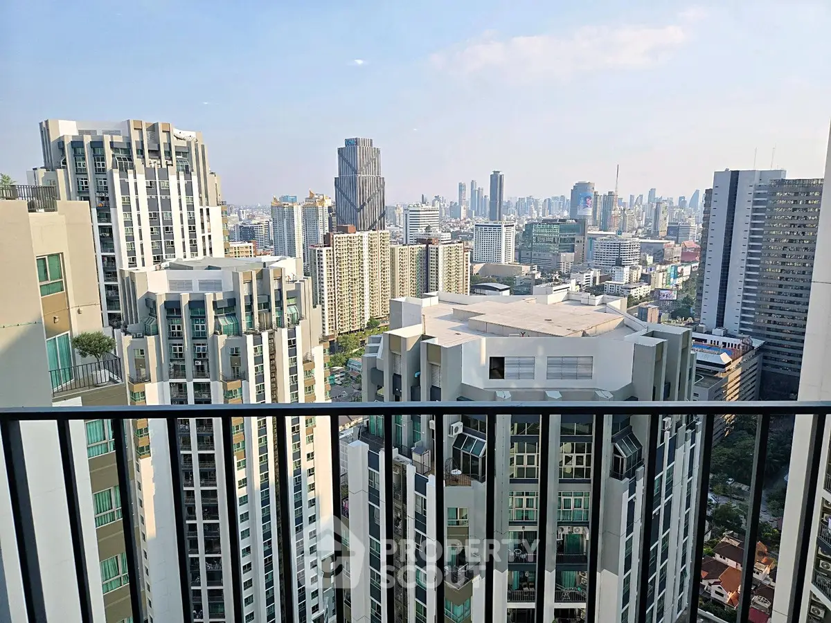 Stunning cityscape view from a high-rise balcony, showcasing modern urban living.